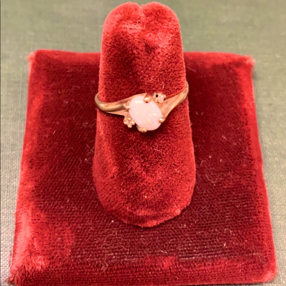 10 k Opal ring with two small diamond chips.